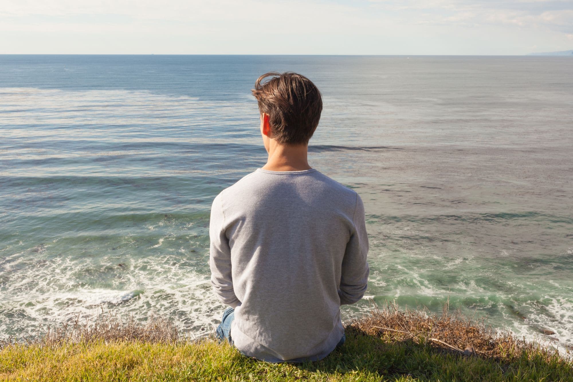 man looking at horizon