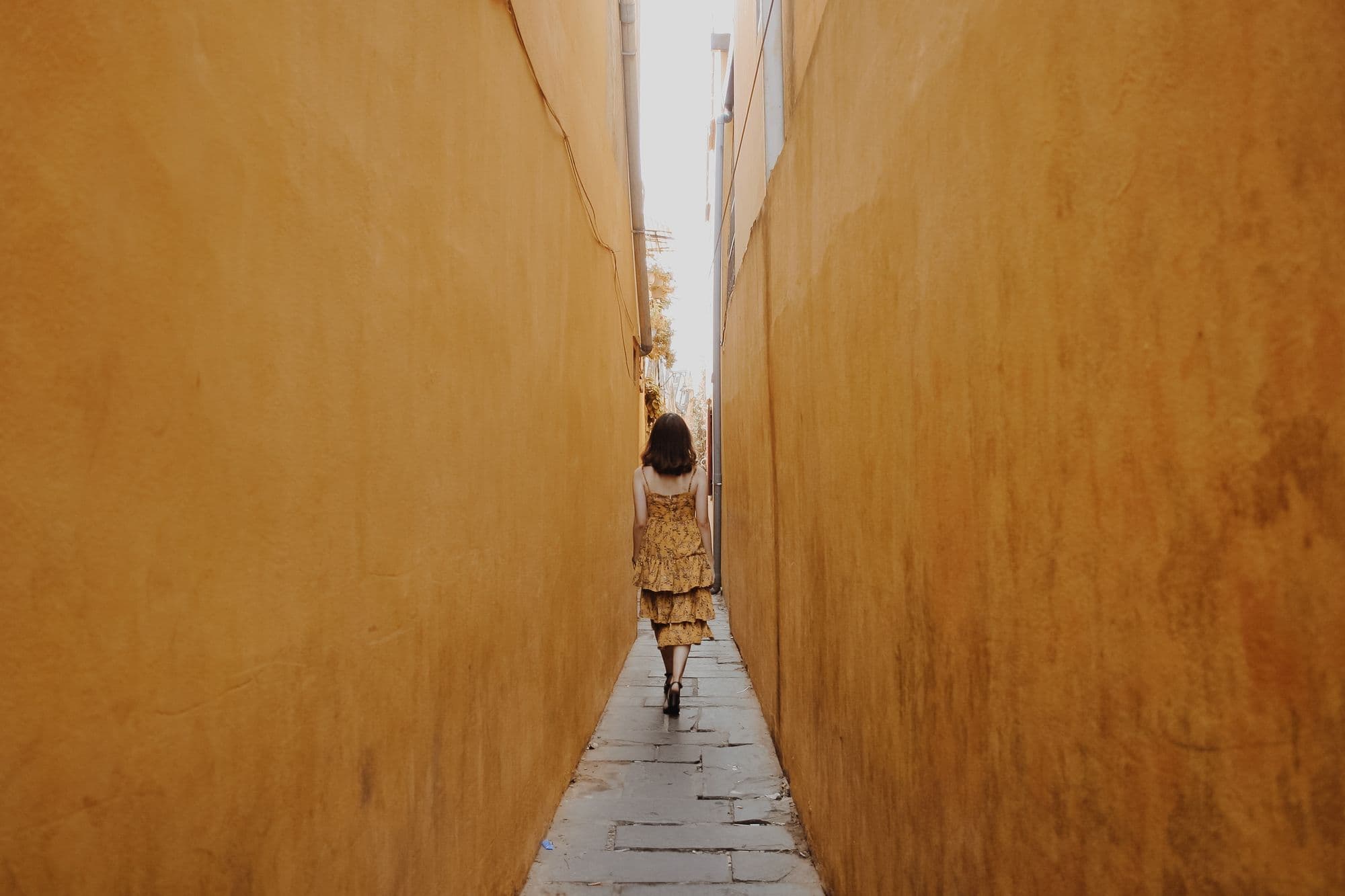 Woman walking through pathway