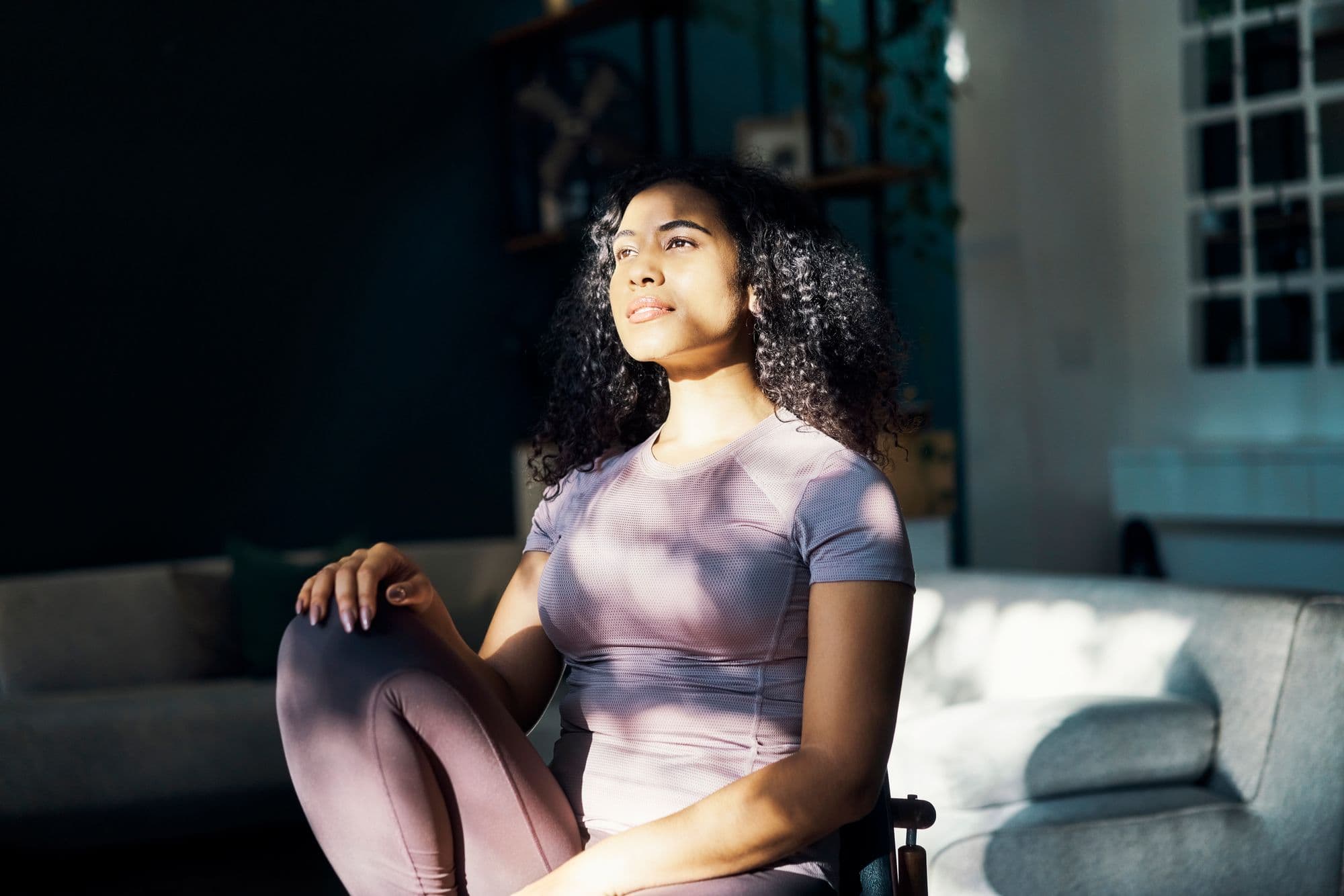 Yoga, meditation and relax mindset of a woman from Brazil feeling spiritual, gratitude and peace. Wellness exercise of a person in the sun at home with a calm mind after a fitness and health workout