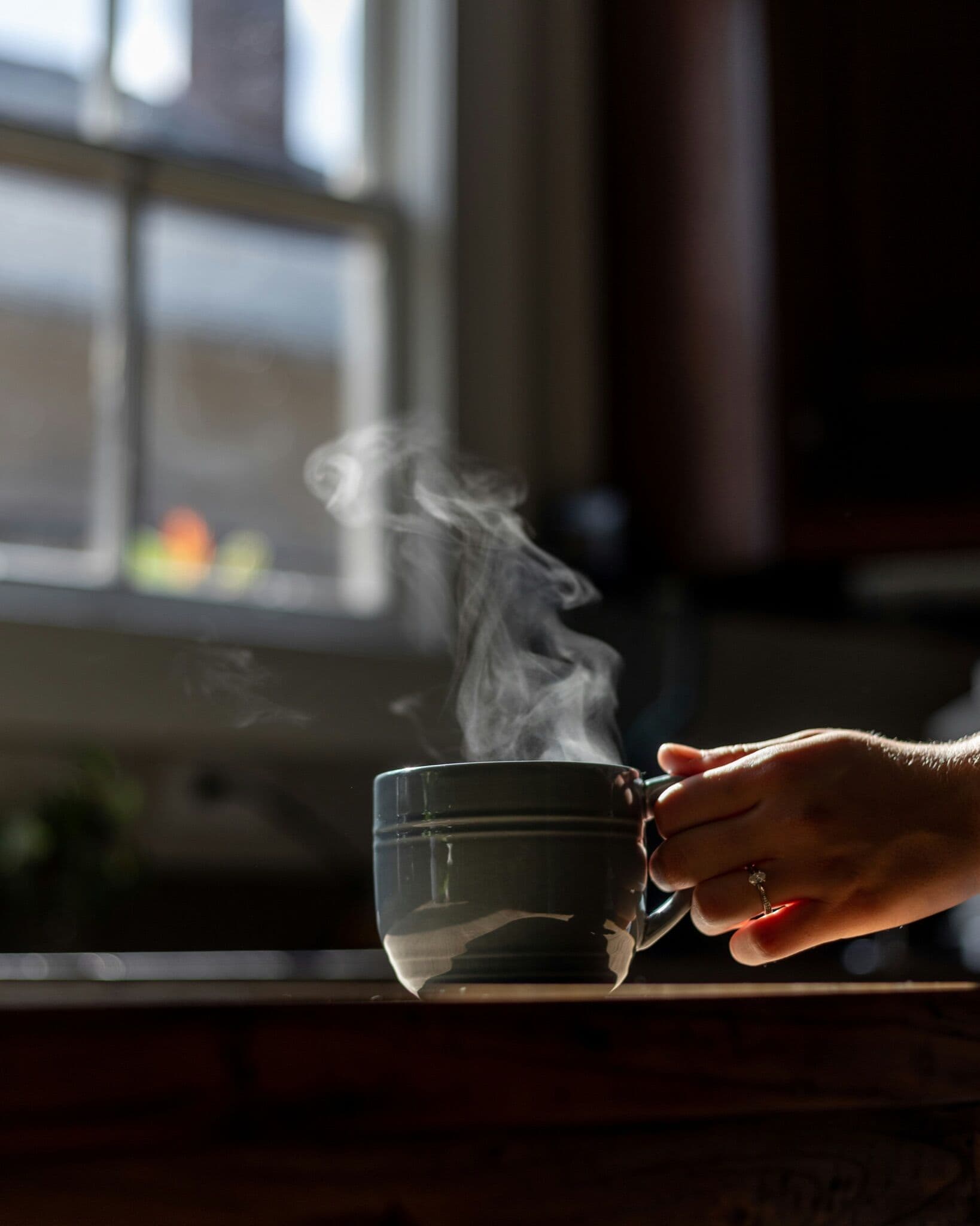 Hands holding a warm morning drink